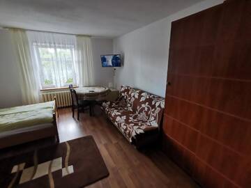 Фото номера Четырехместный номер Фермерские дома Pokoje Gościnne Strażnica г. Ярославец 8